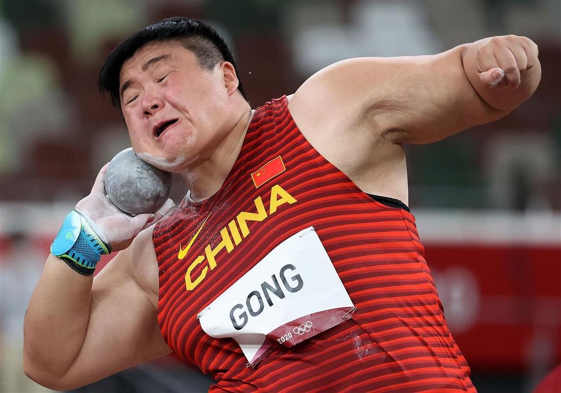 历史上为中国夺得第一枚奥运金牌的相关图片